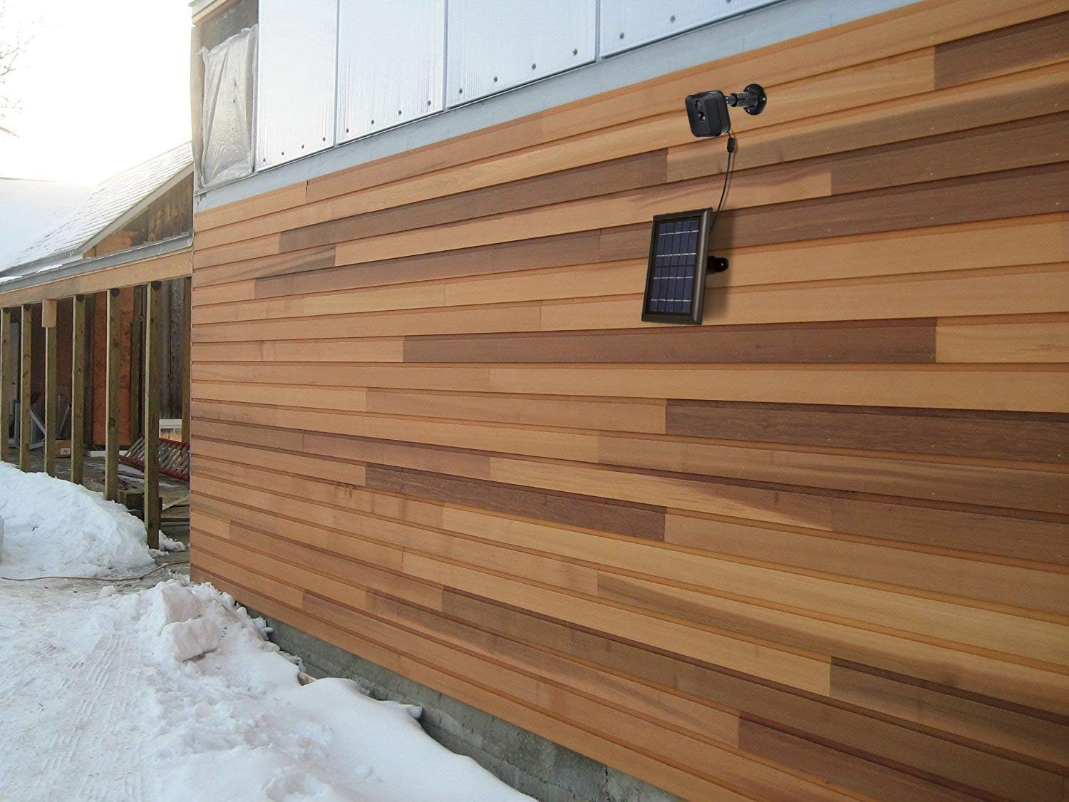 Wasserstein panel installed beside Blink camera illustrating continuous powered surveillance