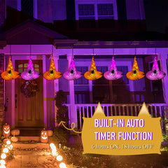 WATERGLIDE lit witch hats on a dark porch creating warm Halloween ambiance