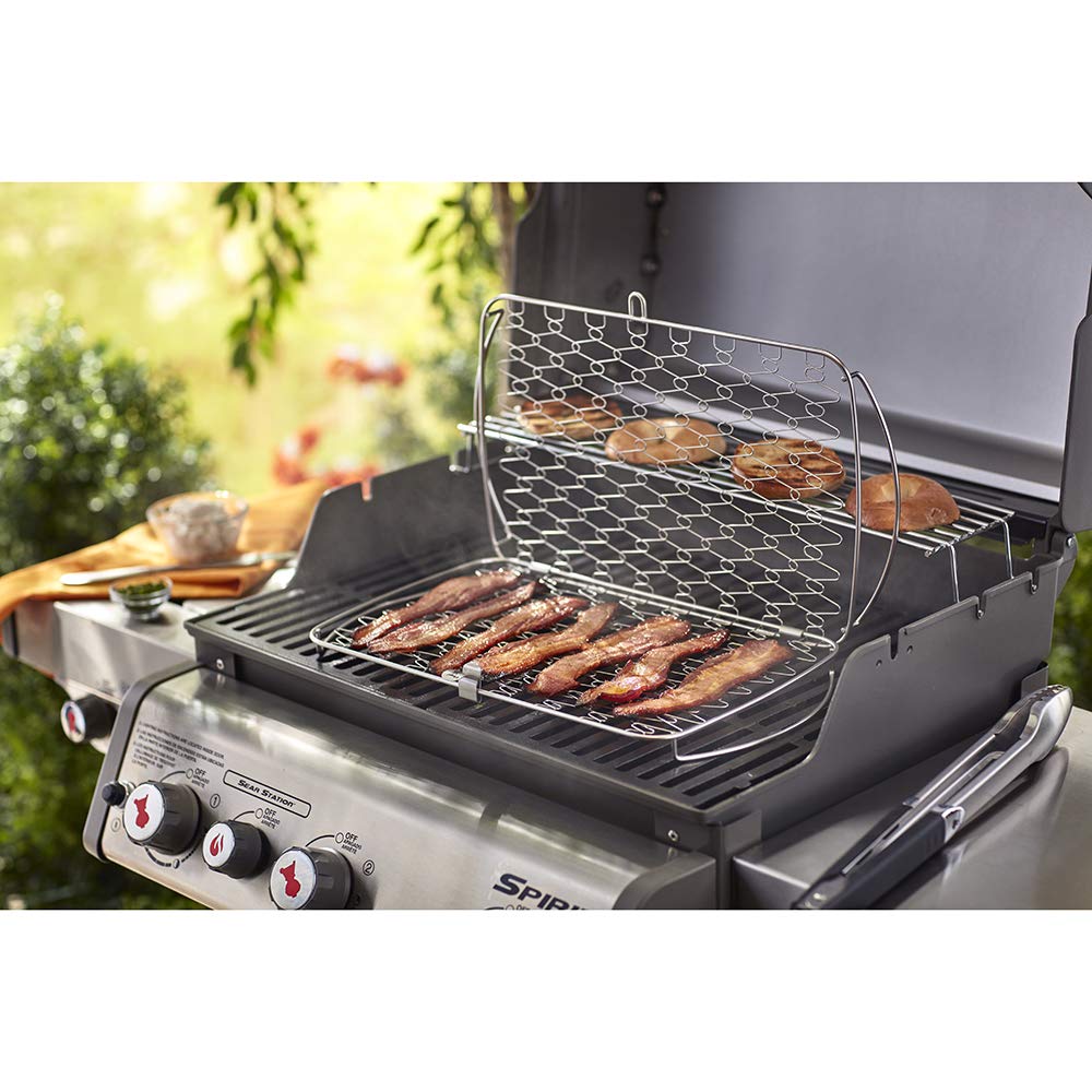 Weber basket loaded with sliced vegetables on the grill showing no sticking and even char marks