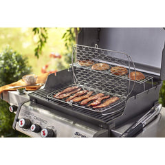 Weber basket loaded with sliced vegetables on the grill showing no sticking and even char marks