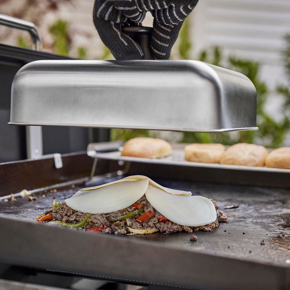 Weber T-shaped handle close-up offering safe grip and easy lifting benefit
