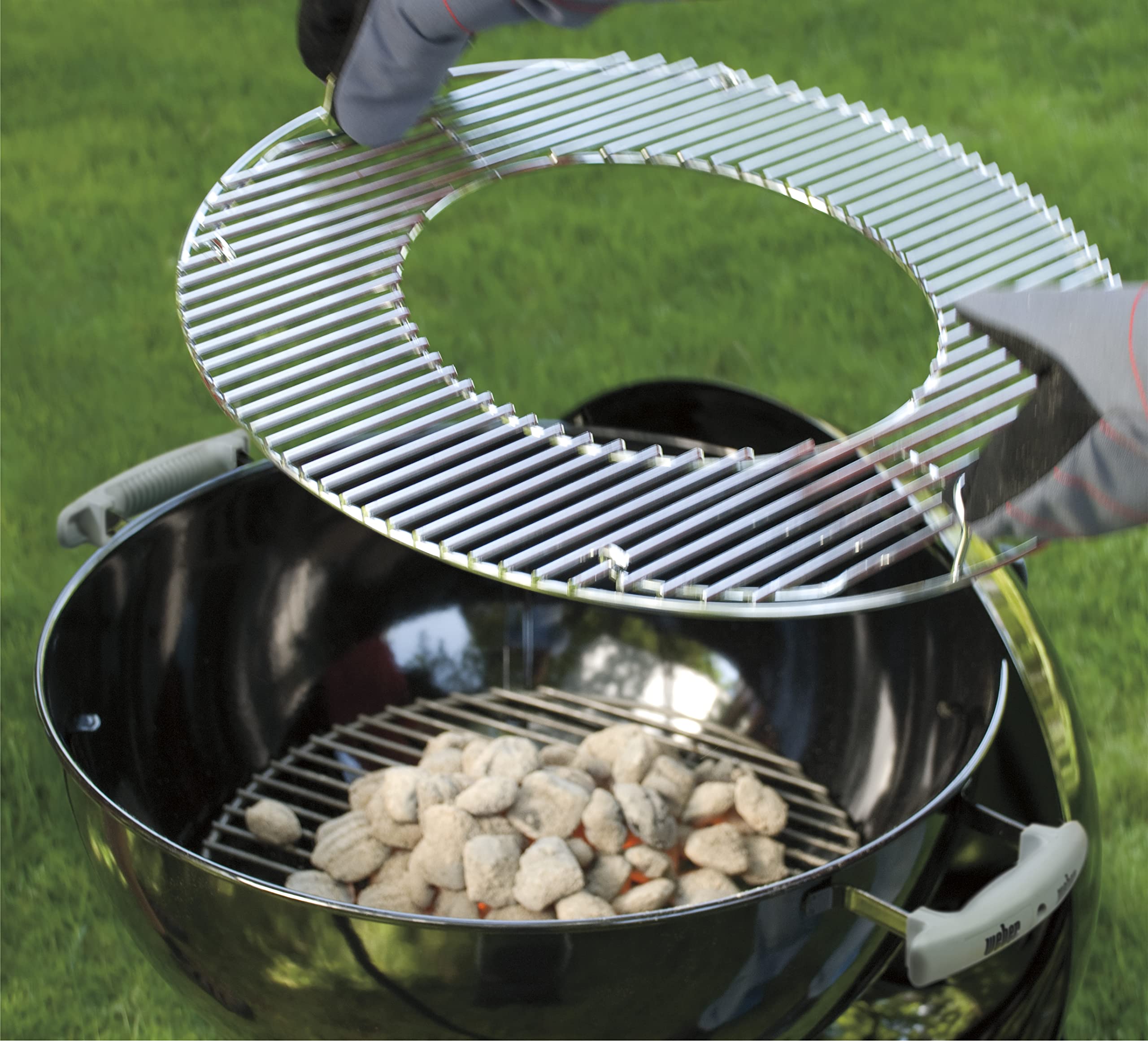 Weber center removed to add charcoal quickly without moving food