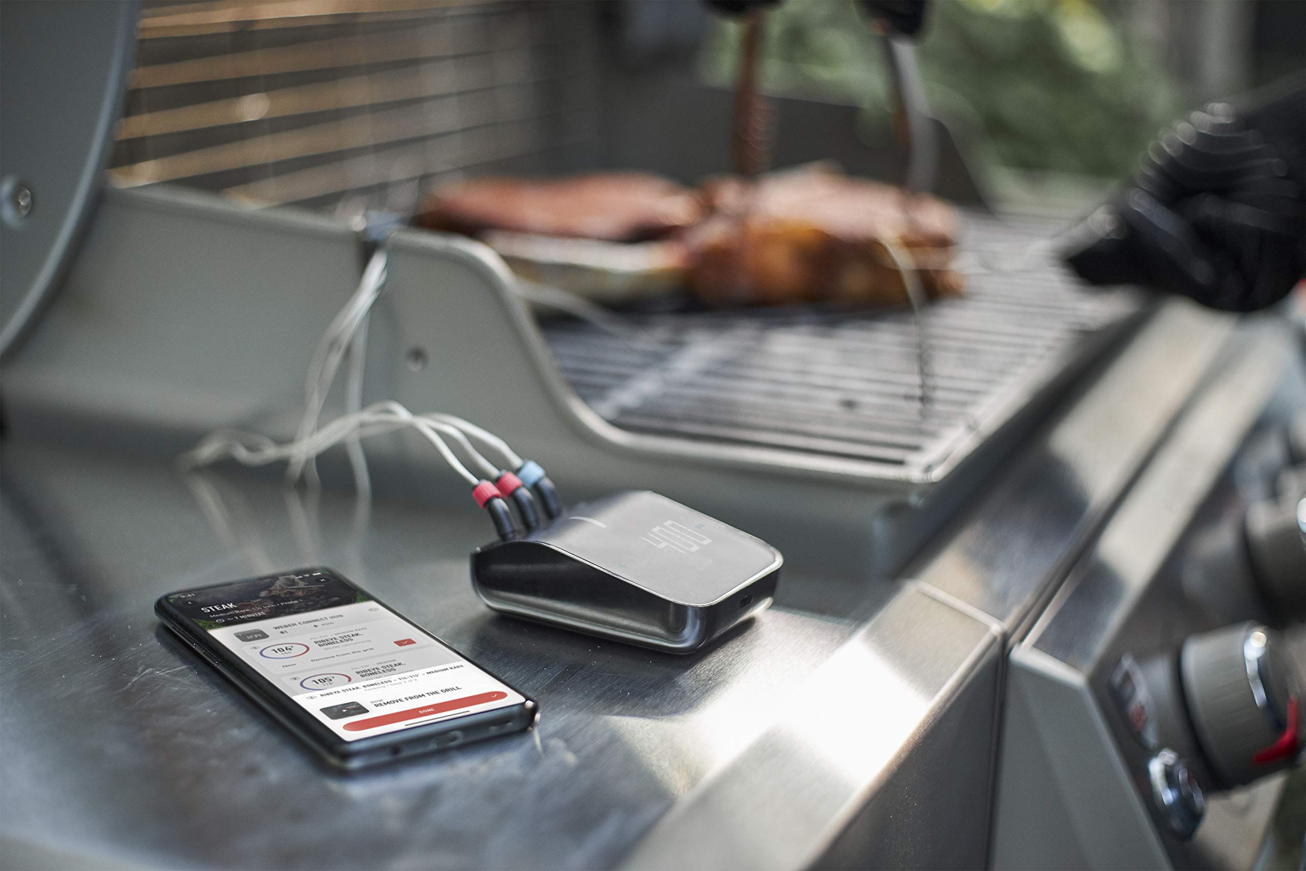 Weber Connect in backyard grilling scene showing streamlined multi-item cooking benefit