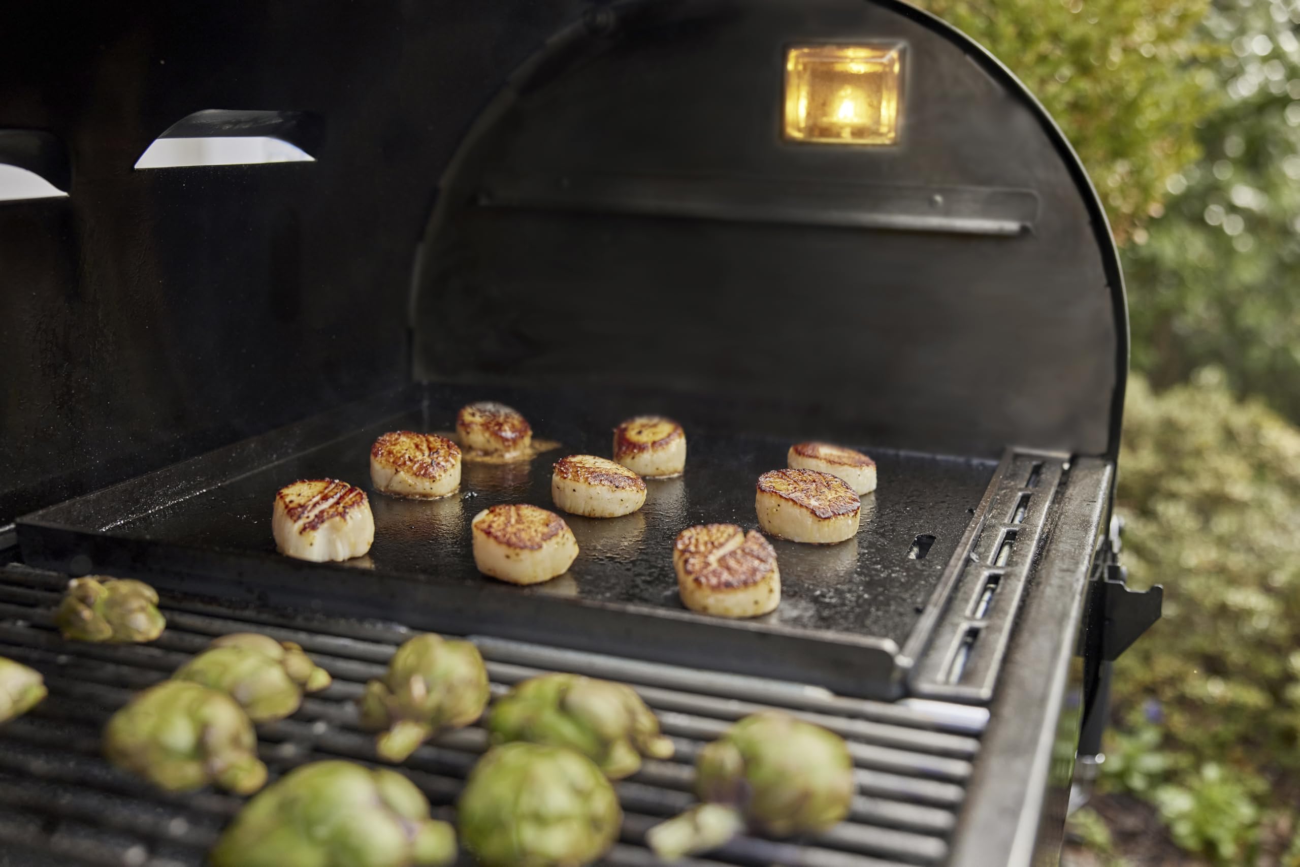 Weber Crafted griddle beside sear grate showing dual-cooking versatility benefit