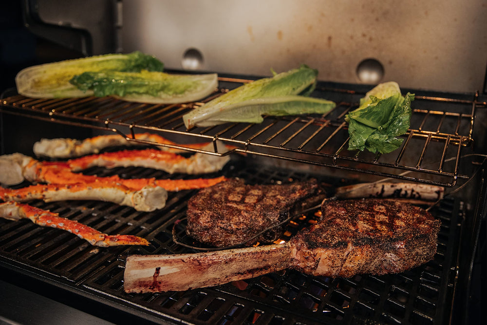 Weber grate with nine steaks to show capacity and consistent cooking benefit