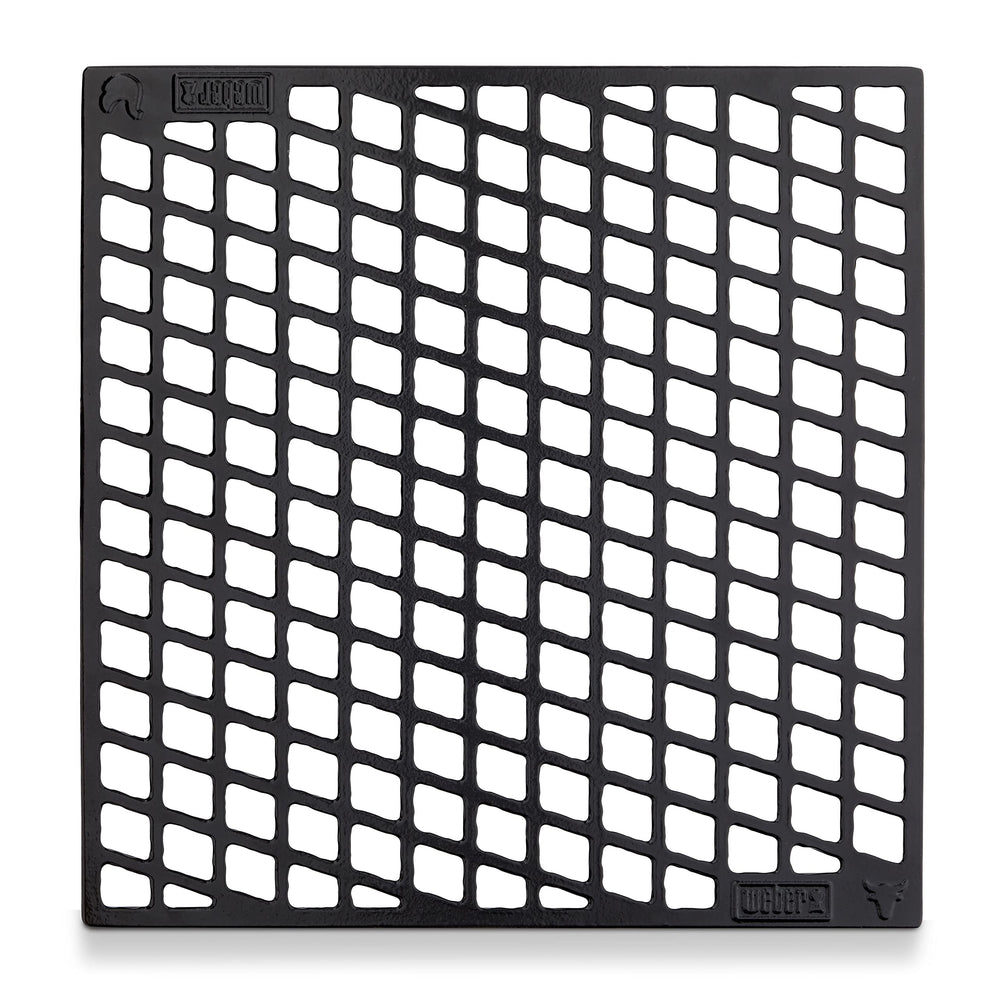 Weber close‑up of thicker bars delivering bold sear marks and heat contact