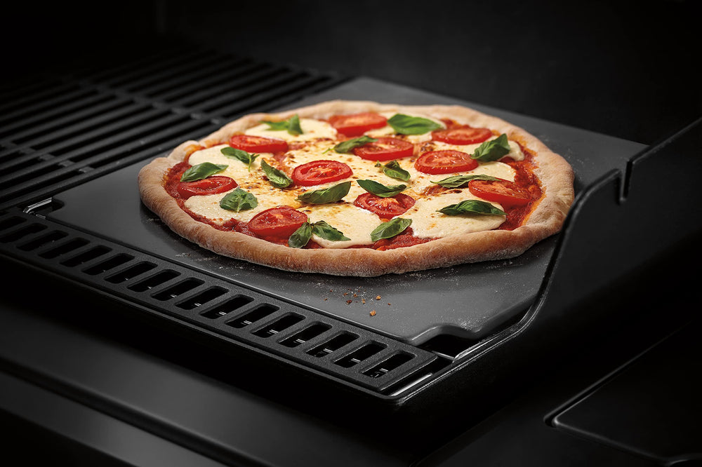 Weber crafted baking stone installed in grill grate demonstrating secure, compatible fit