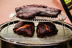 Weber expansion rack installed on grill with food, expanding capacity