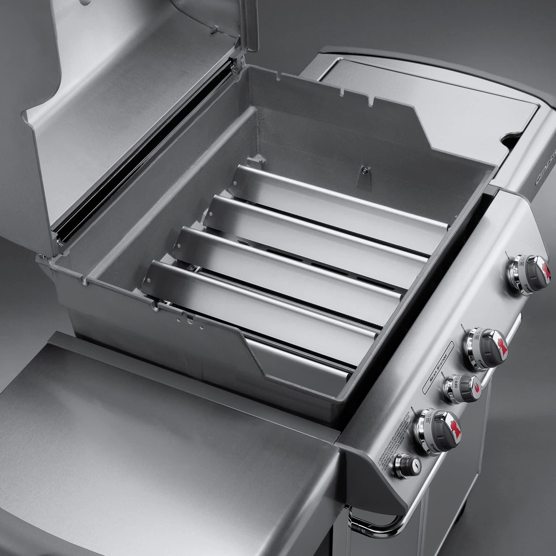 Weber bars in a backyard grill setting demonstrating restored grill performance
