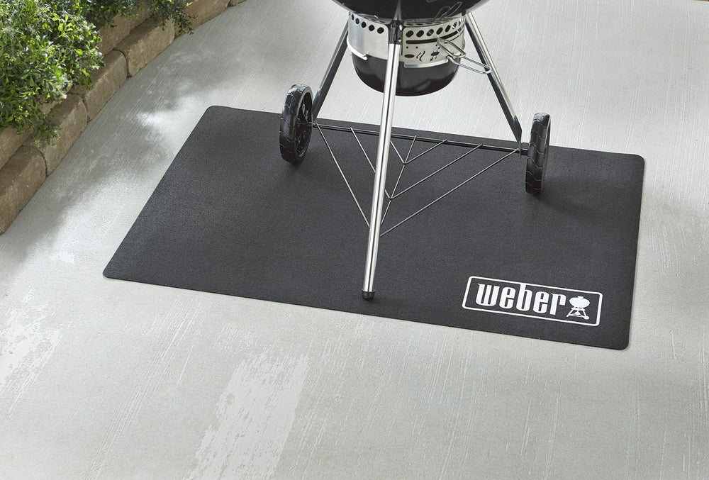Weber floor protection mat under a gas grill catching ash and grease effectively
