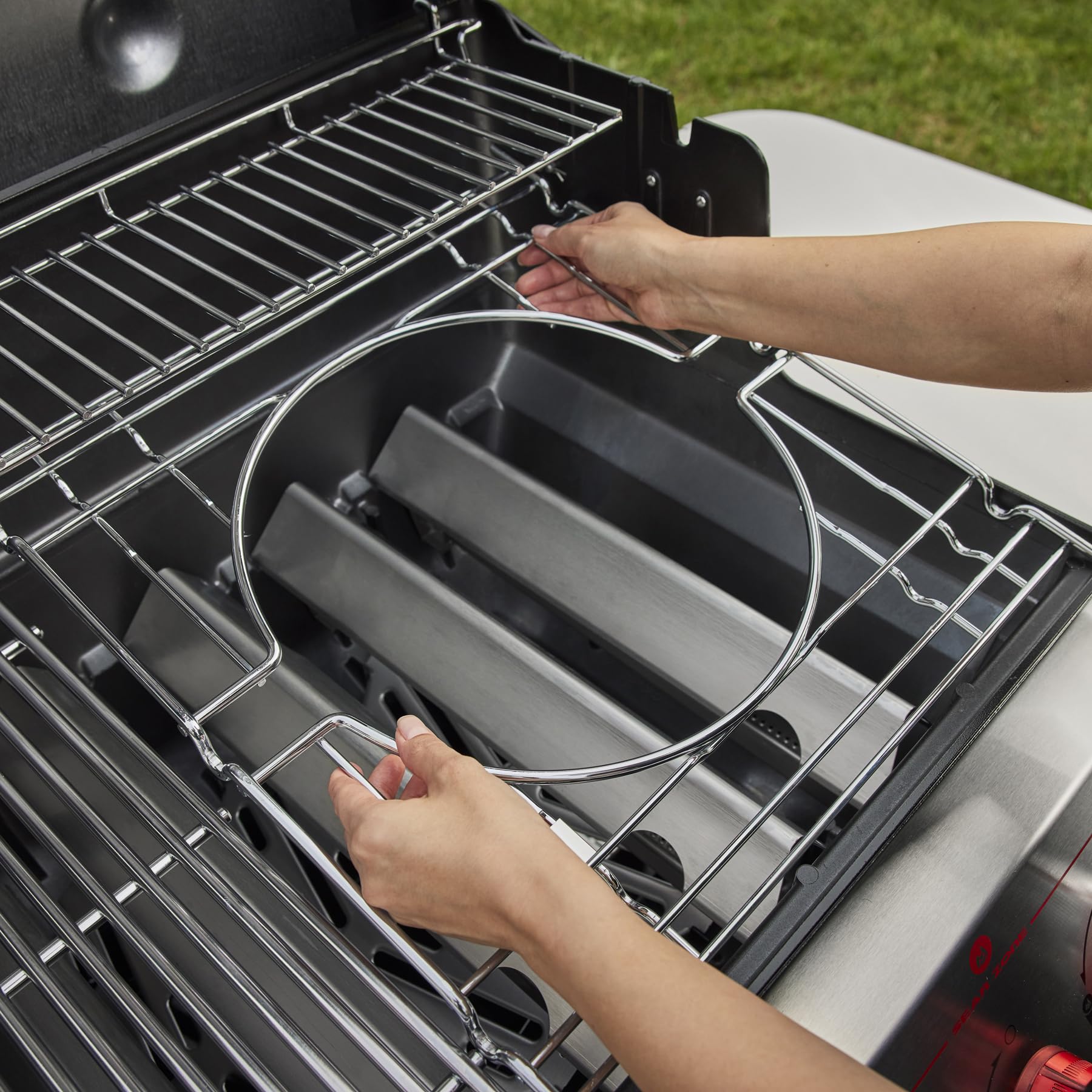 Weber Genesis S-315 close-up of Flavorizer bars vaporizing juices to boost flavor