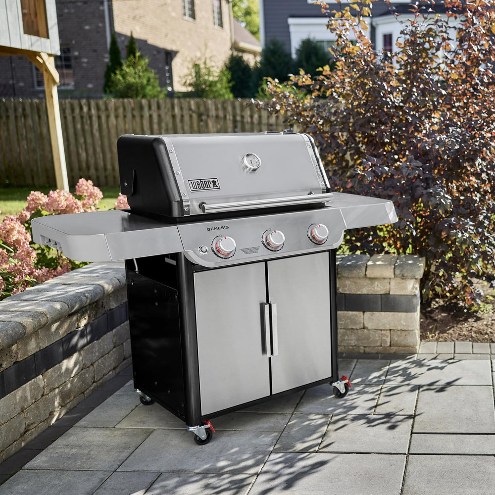 Weber Genesis S-315 side tables and warming rack providing prep space and holding food