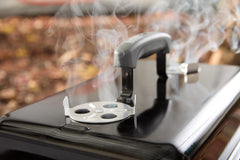 Weber charcoal tray and char-rail insert visible to organize coals for indirect cooking