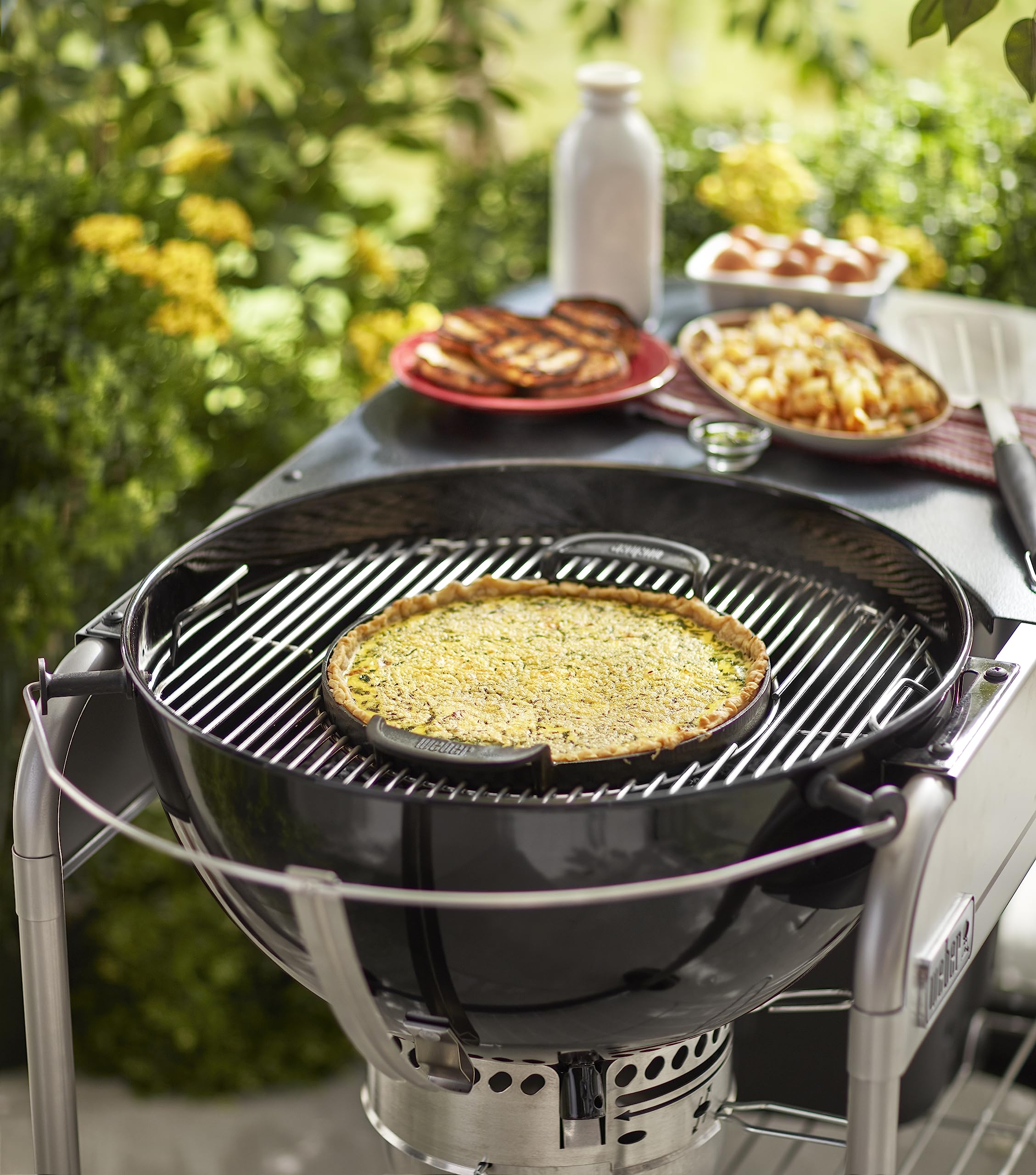 Weber griddle size comparison with hand showing scale and generous cooking area