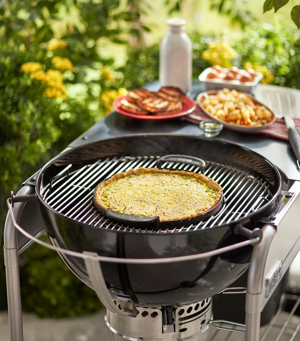 Weber griddle size comparison with hand showing scale and generous cooking area