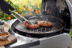 Weber sear grate installed in a 22.5-inch charcoal grill concentrating heat for searing