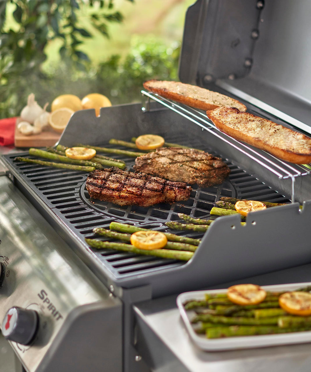 Lifestyle scene of Weber sear grate in backyard grill setup enabling restaurant-style sears