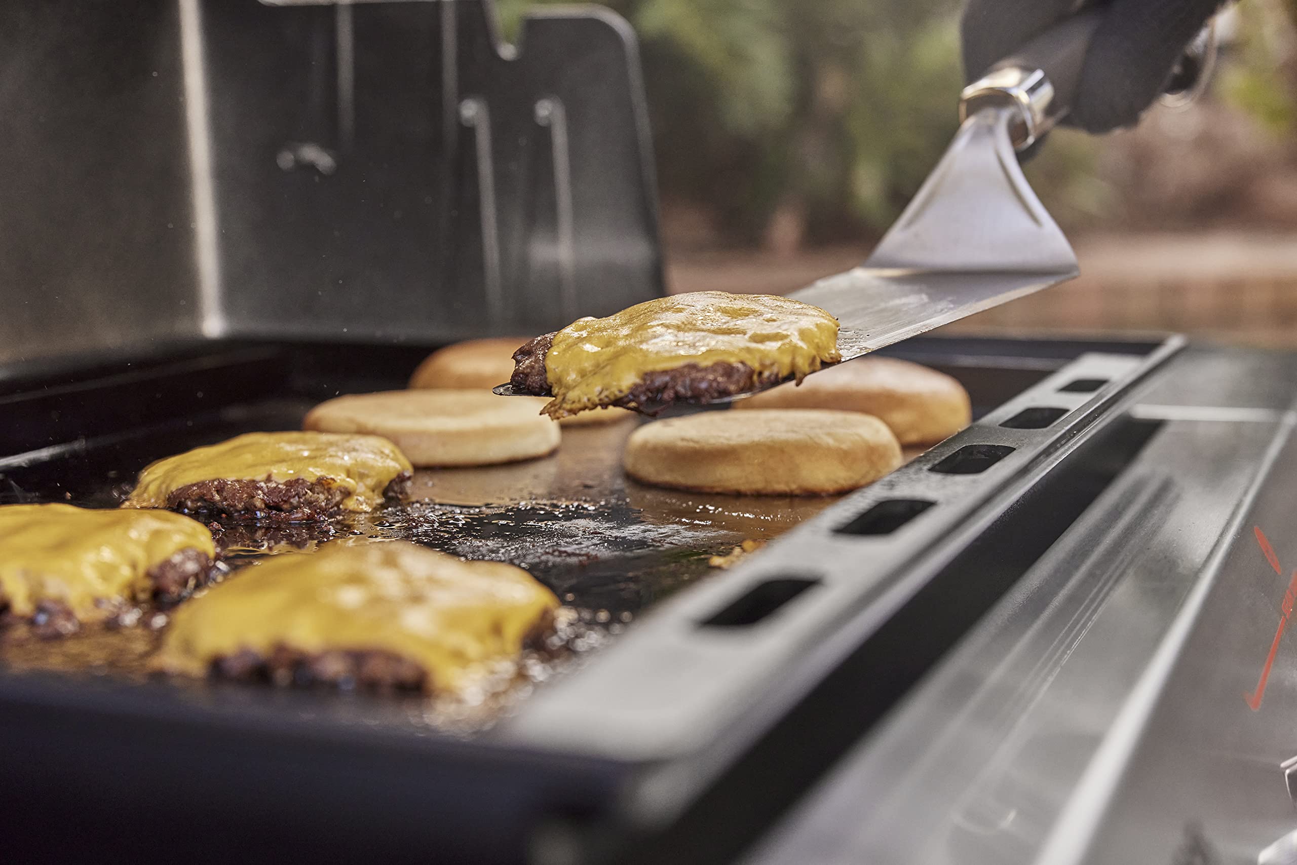 Weber griddle cooking pancakes and eggs for quick versatile outdoor breakfasts