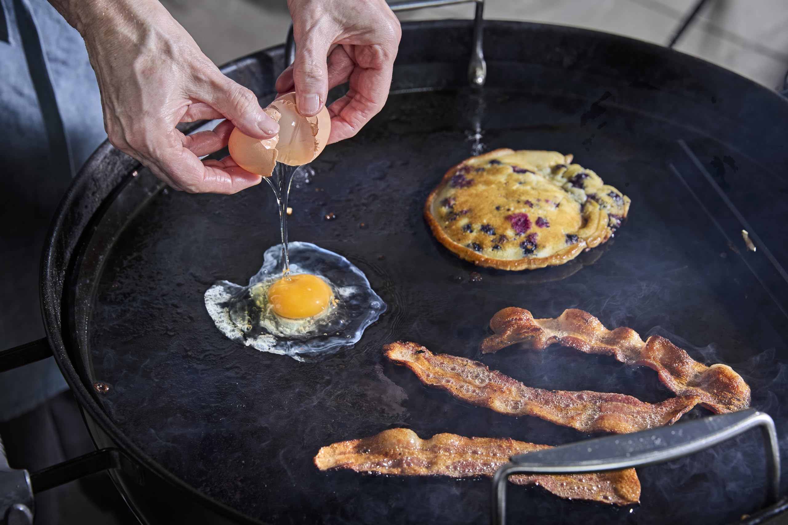 Weber griddle close-up of pre-seasoned surface highlighting easy-release benefit