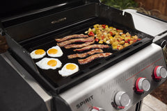 Weber griddle close-up of pre-seasoned carbon steel surface delivering even browning benefits