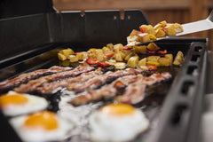 Weber griddle grease channel detail highlighting integrated drainage to reduce spills and mess
