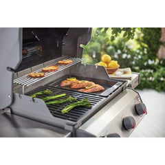 Weber griddle detail showing sloped surface and grease reservoir for cleaner cooking