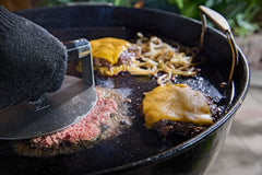 Weber griddle installed in 22" kettle illustrating expanded cooking capability benefit