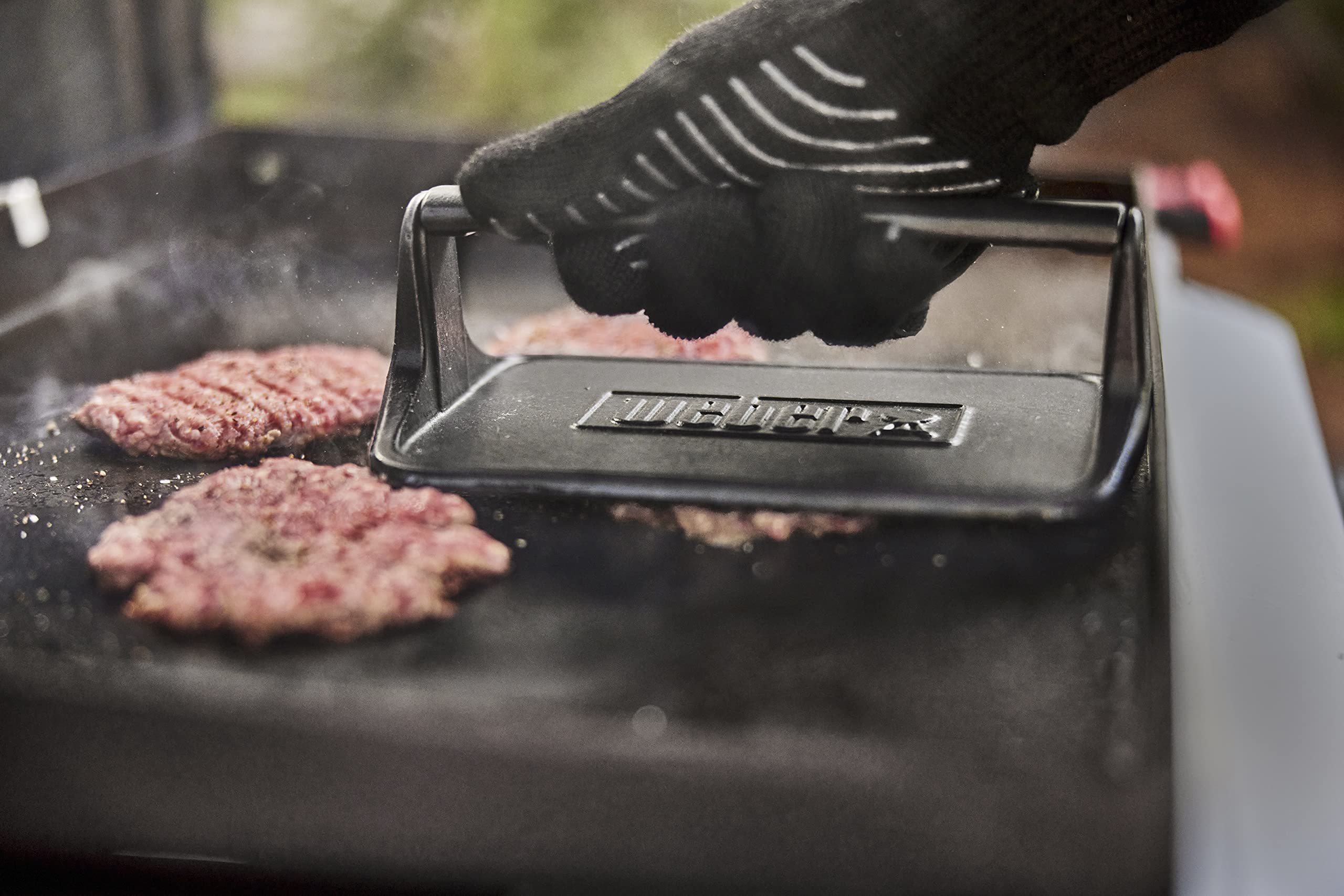Weber handle detail for comfortable grip and controlled pressing during use