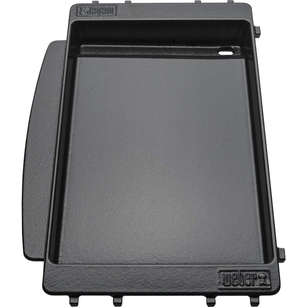 Weber griddle beside Spirit grill to show size and easy one-grate replacement fit