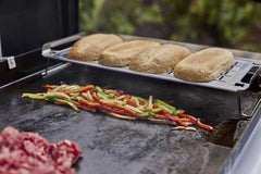 Weber warming rack handle and hang loop for secure grip and convenient storage by grill
