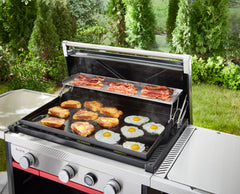 Weber warming rack toasting buns while griddle cooks below for faster service