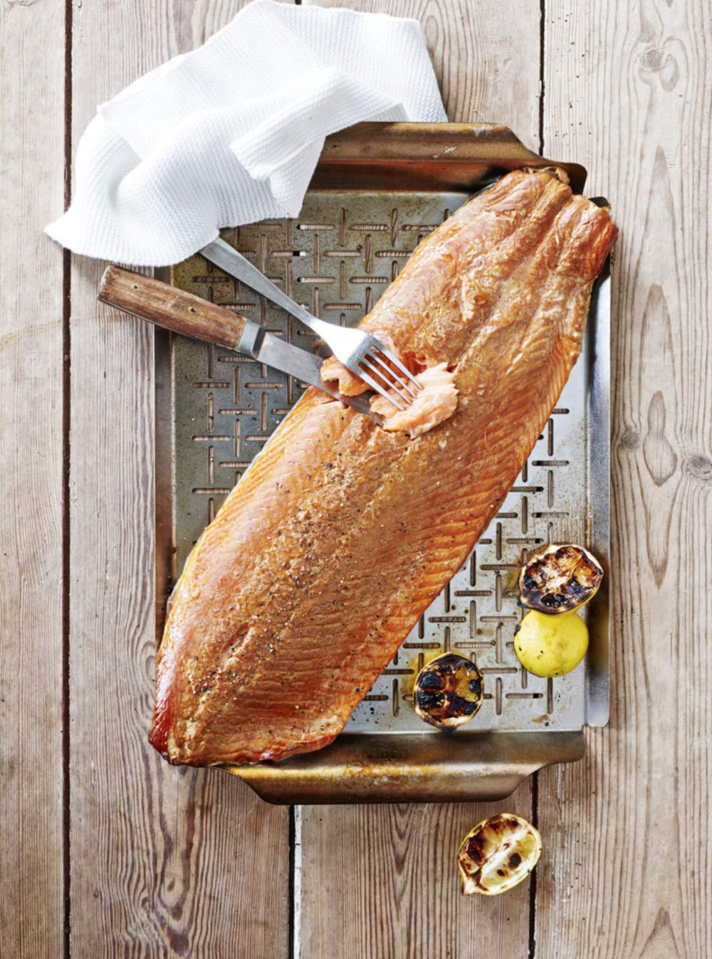 Weber grill pan close-up of 1/8-inch slits for smoky flavor and liquid drainage
