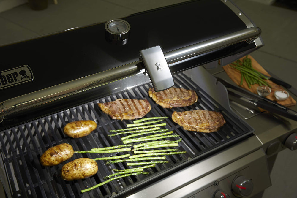 Weber handheld Grill ’N Go used as task light for prep convenience