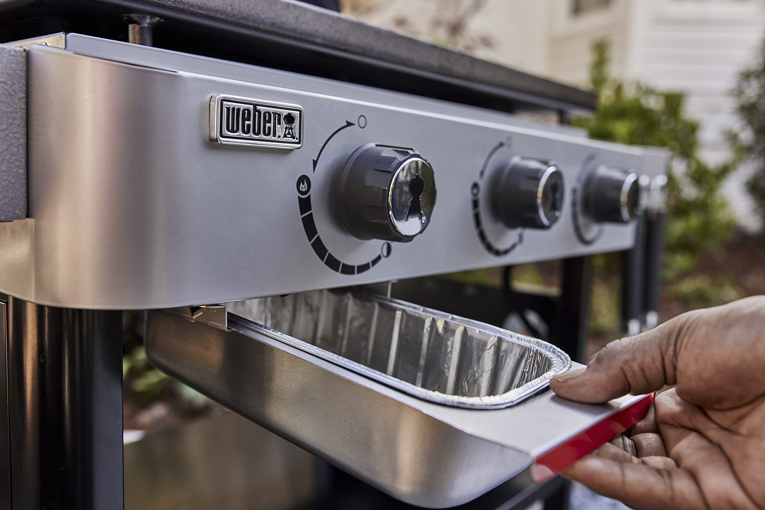 Weber hanging storage on rail showing convenient organization near grill