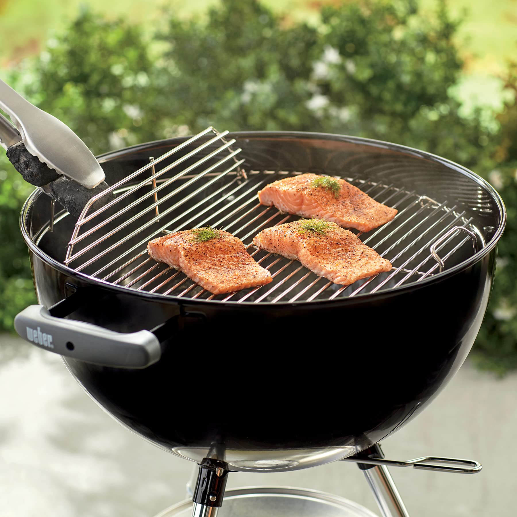 Weber cooking grate installed in 18-1/2 inch kettle illustrating correct fit and cooking setup