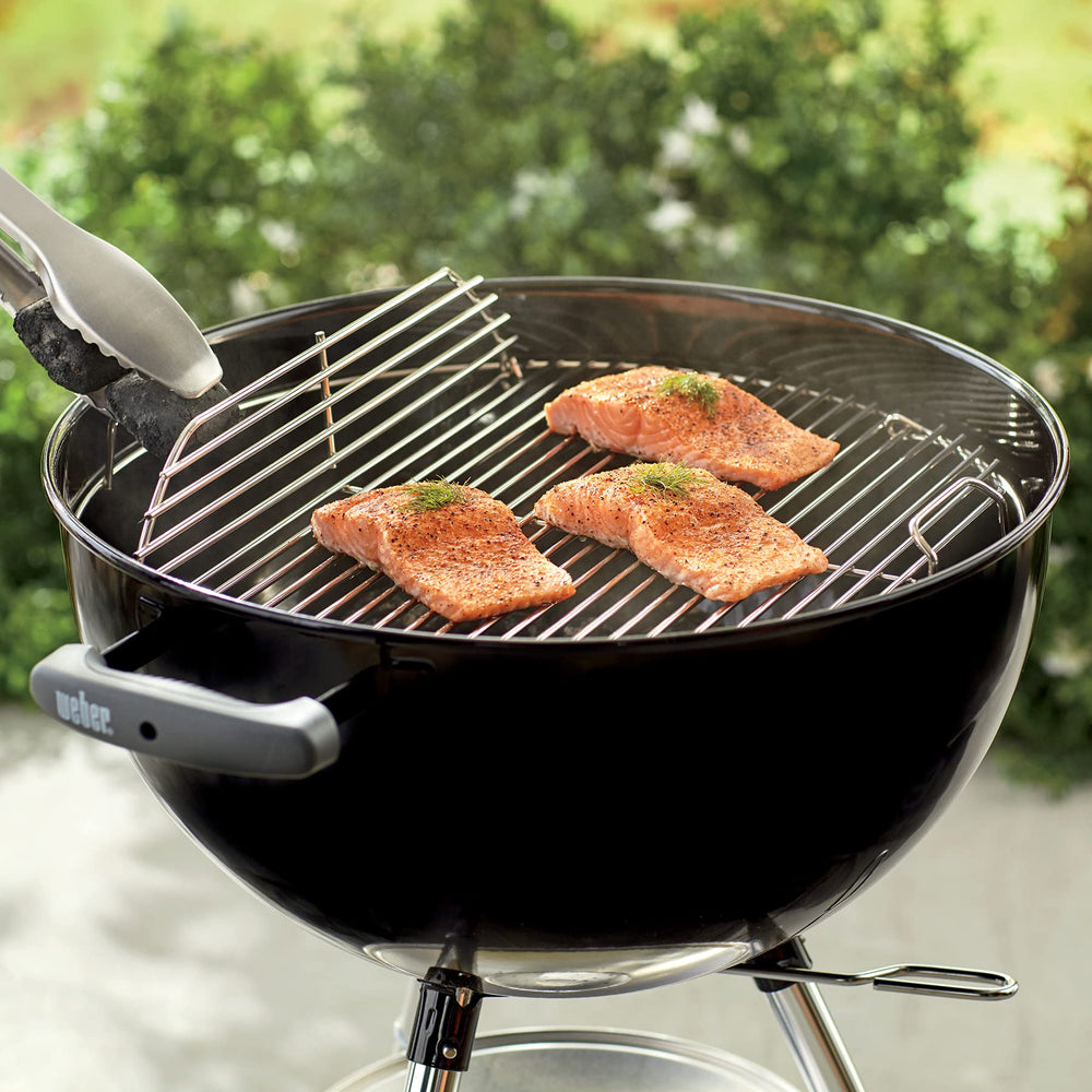 Weber cooking grate installed in 18-1/2 inch kettle illustrating correct fit and cooking setup