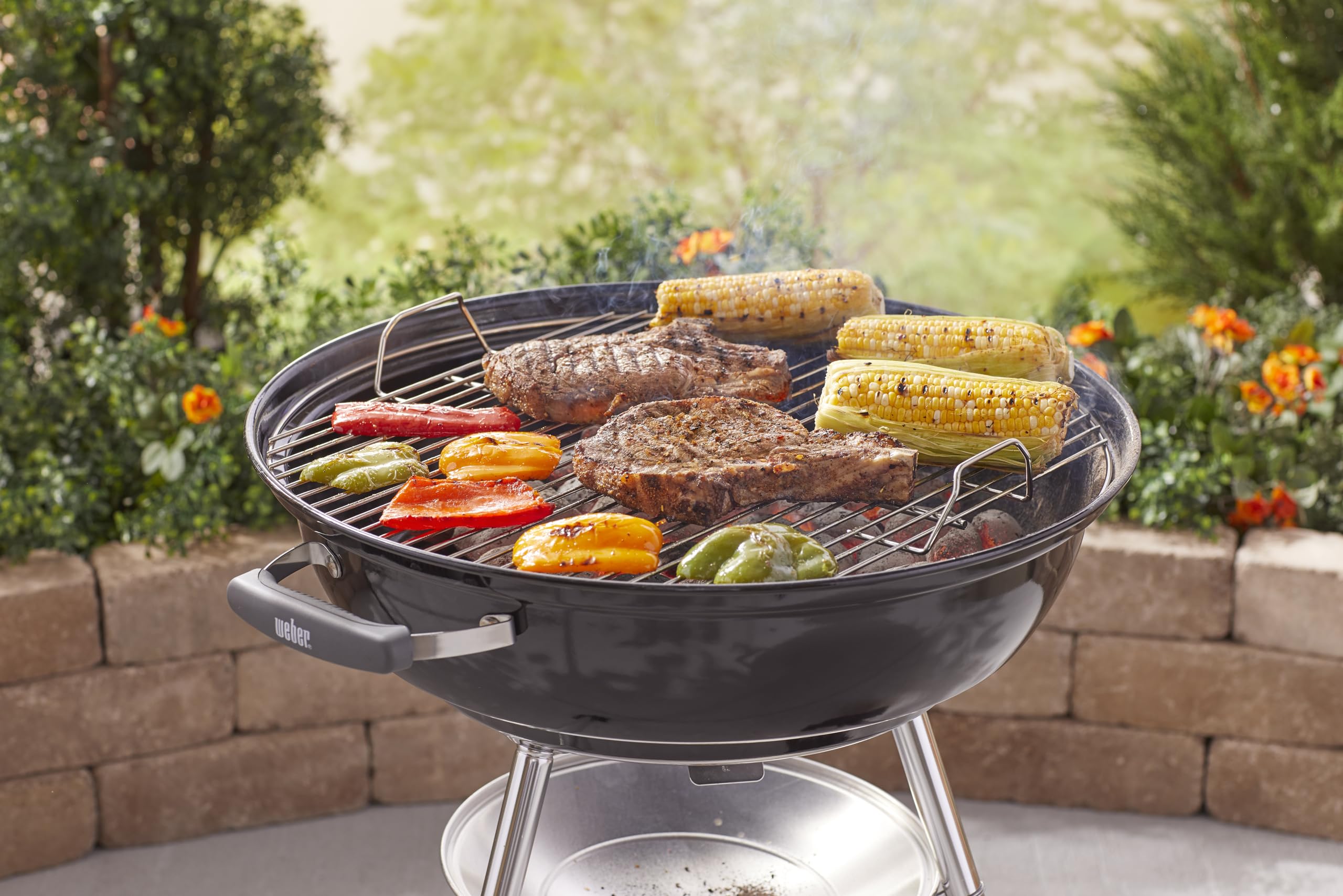 Weber Jumbo Joe lid handle and angled hook for safe handling and tidy lid placement