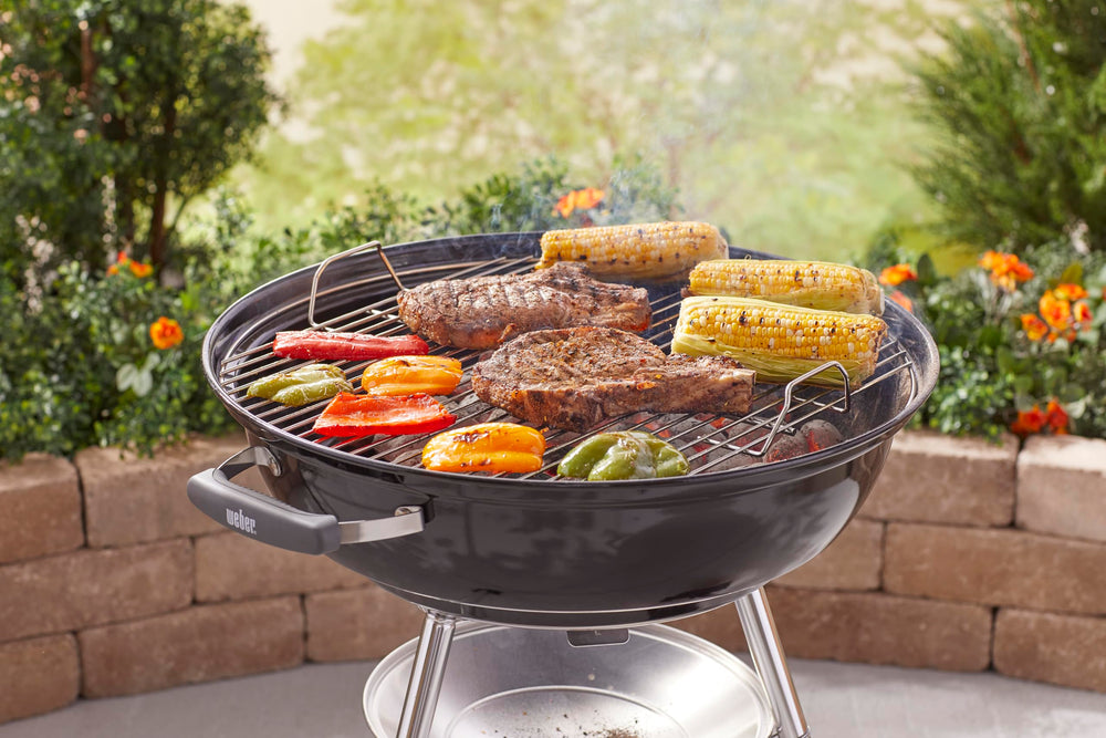 Weber Jumbo Joe lid handle and angled hook for safe handling and tidy lid placement