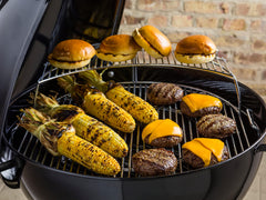 Weber Master-Touch Char-Baskets with arranged briquettes for controlled direct and indirect heat