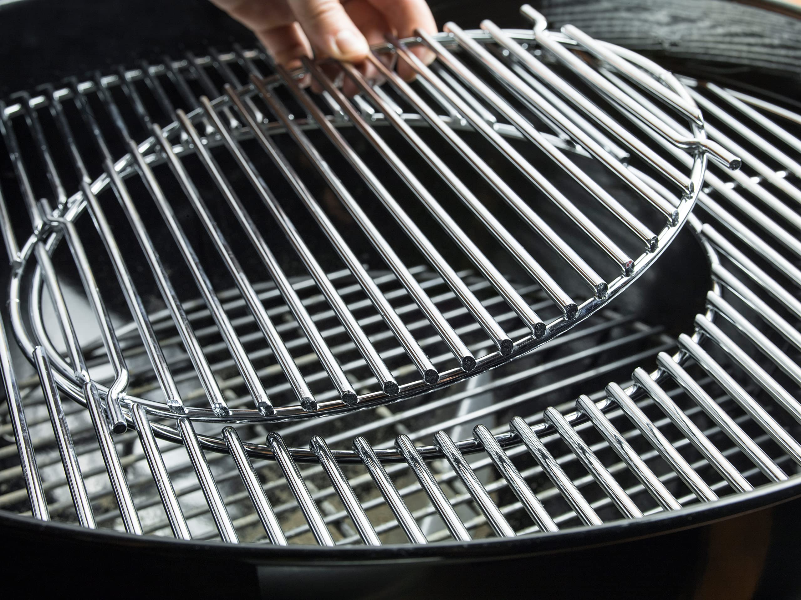 Weber Master-Touch hinged Gourmet BBQ System grate open for easy charcoal access and inserts
