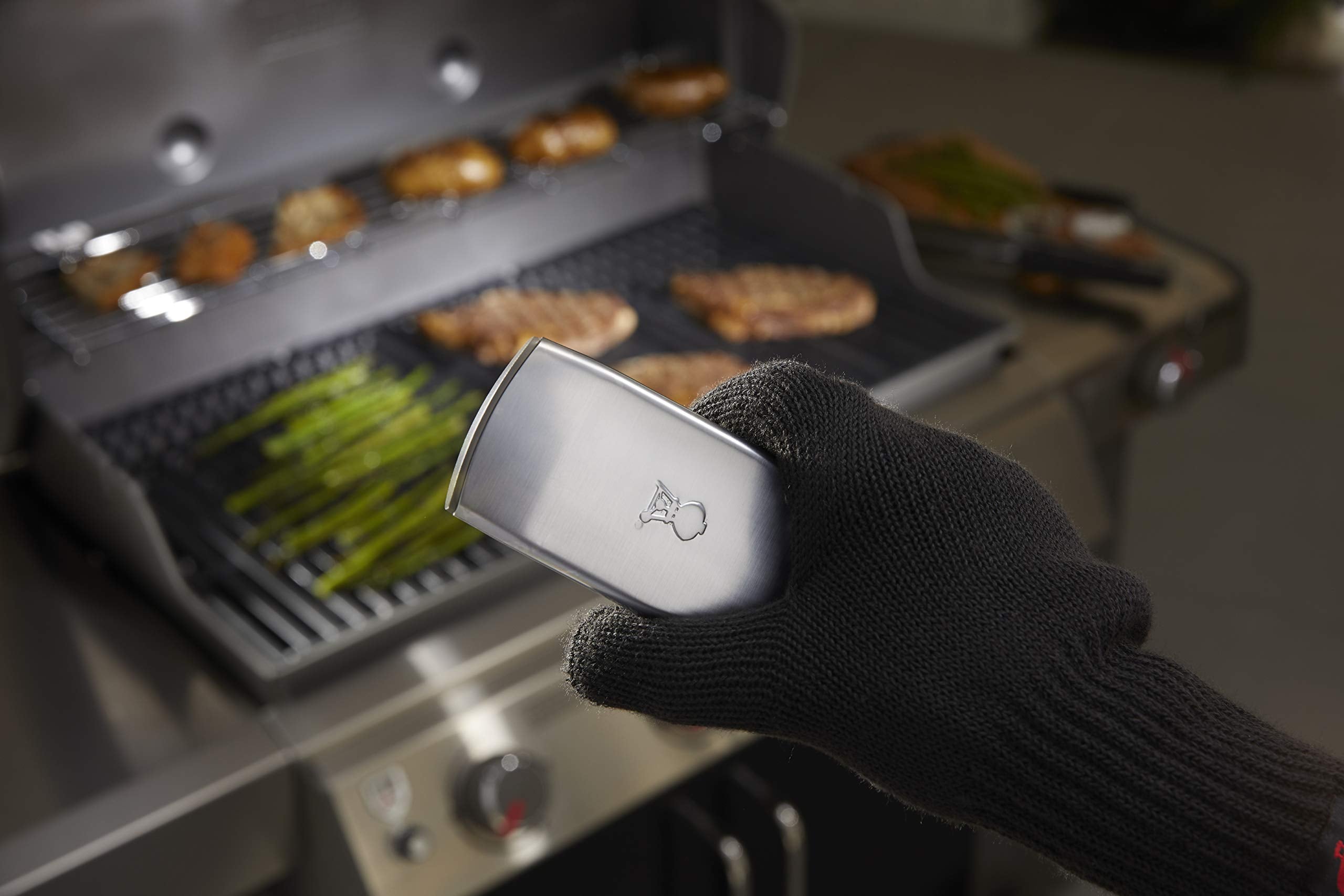 Weber motion-sensor detail highlighting automatic on/off battery savings