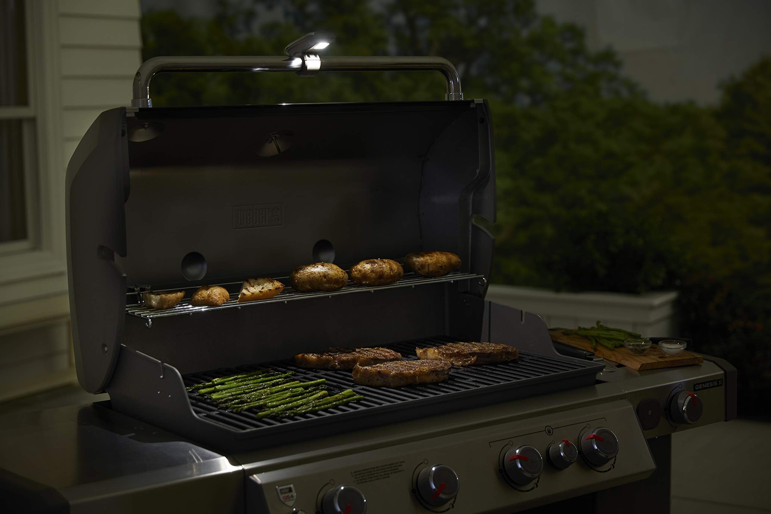 Weber nighttime backyard grilling with Grill ’N Go improving safety