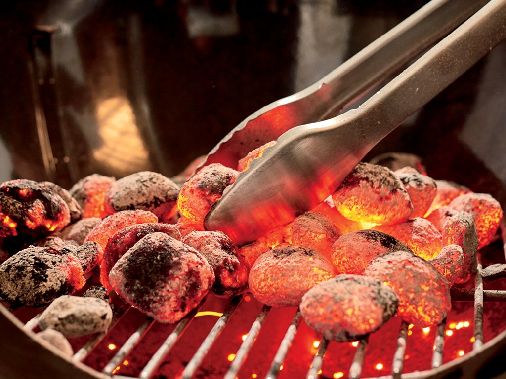 Weber angled lid hook holding lid while grilling for convenient hands-free access