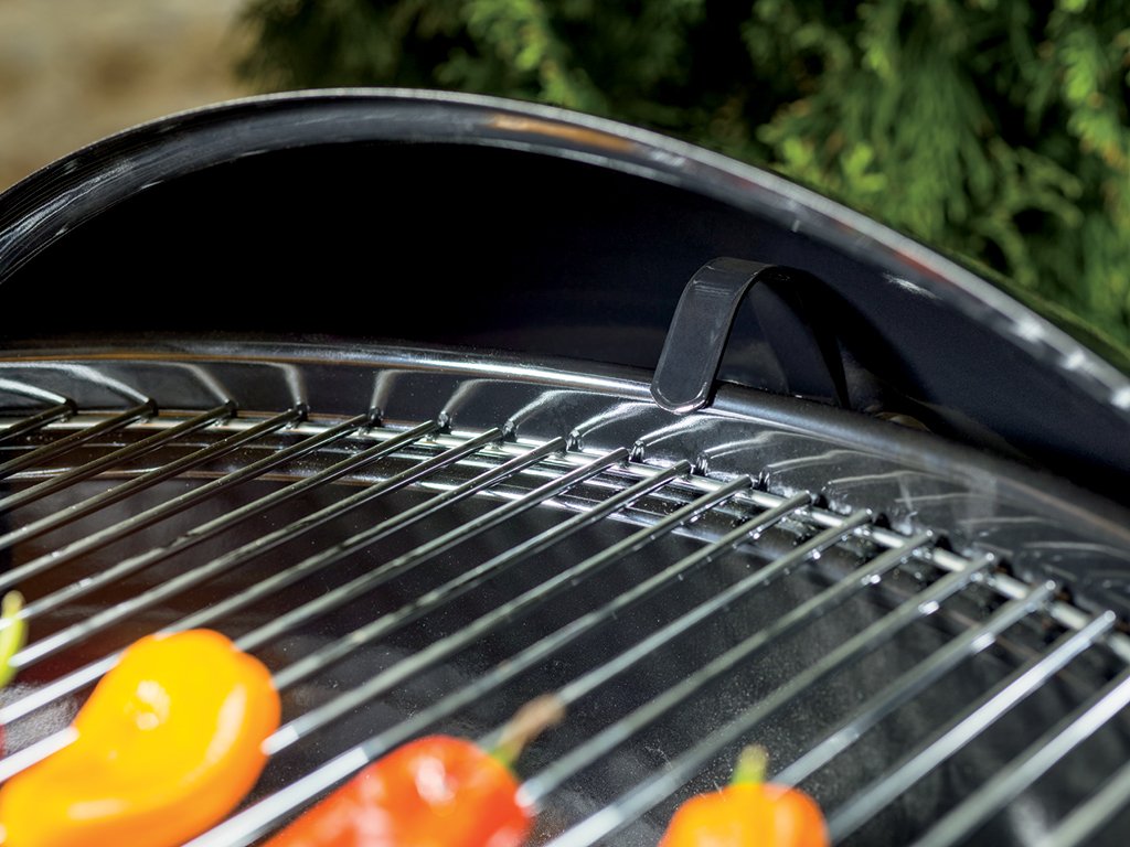 Weber in backyard lifestyle scene showing social grilling and user-friendly design