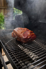 Weber probe inserted in roast inside smart grill showing real-time temperature monitoring