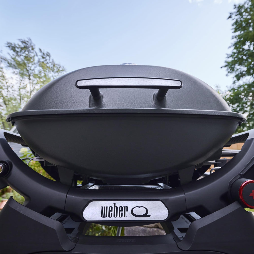 Weber Q 2800N+ side tables stowed in cradle for easy transport and storage