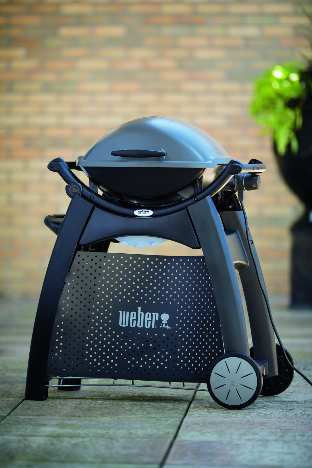 Weber Q Cart storage detail with propane rack and tool hooks benefit organized transport