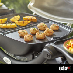 Weber Q griddle with pancakes cooking showing breakfast versatility and even browning