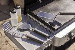 Weber rigid spatula close-up showing sturdy edge for lifting heavy foods