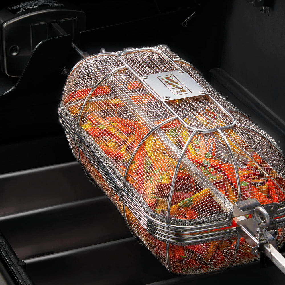 Weber basket with removable divider installed showing dual-compartment cooking advantage